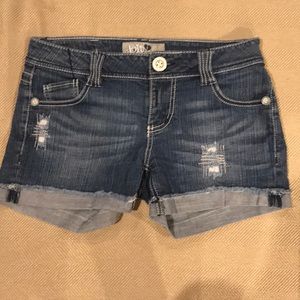 Cuffed distressed jean shorts.